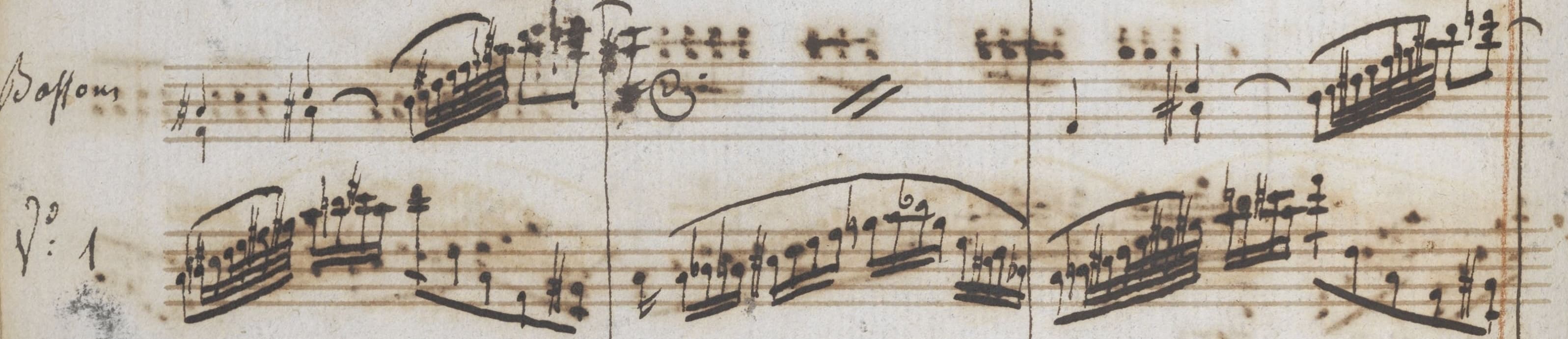 A music manuscript fragment, with musical notes written in black ink on tan paper.